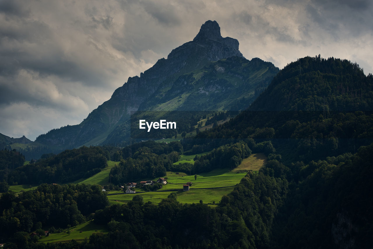 Scenic view of landscape and mountains against sky