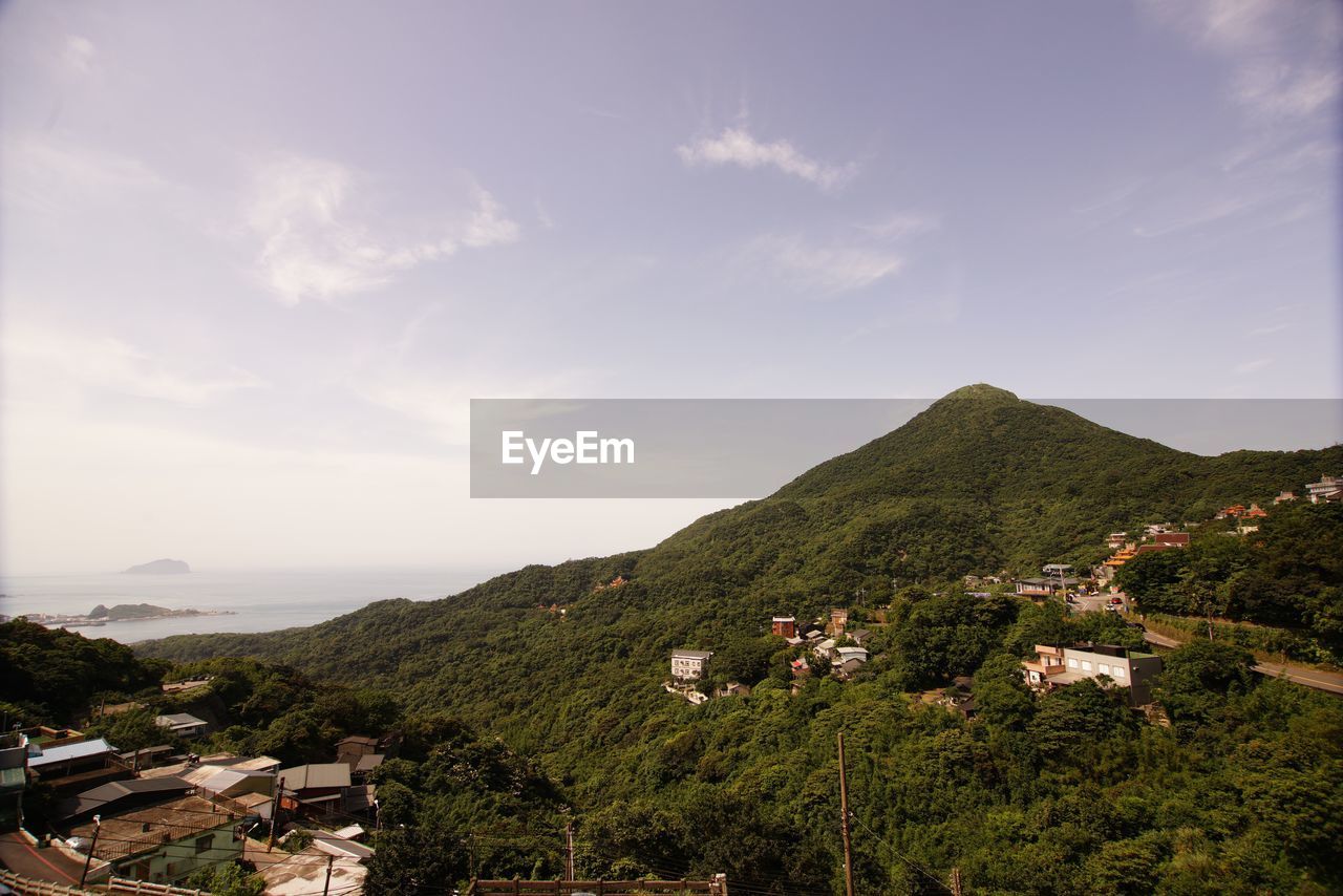 Scenic view of residential buildings against sky