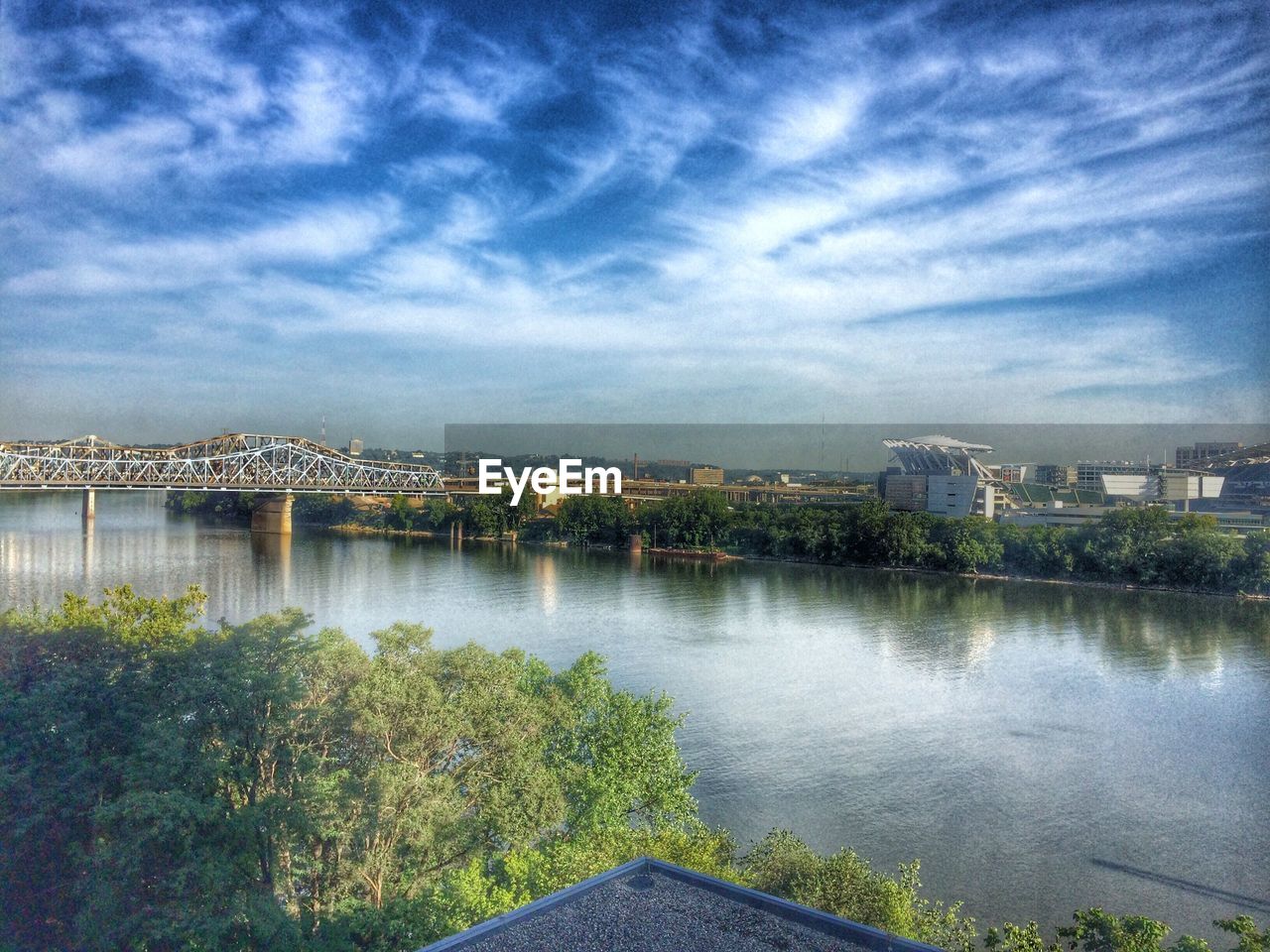 RIVER WITH CITYSCAPE IN BACKGROUND