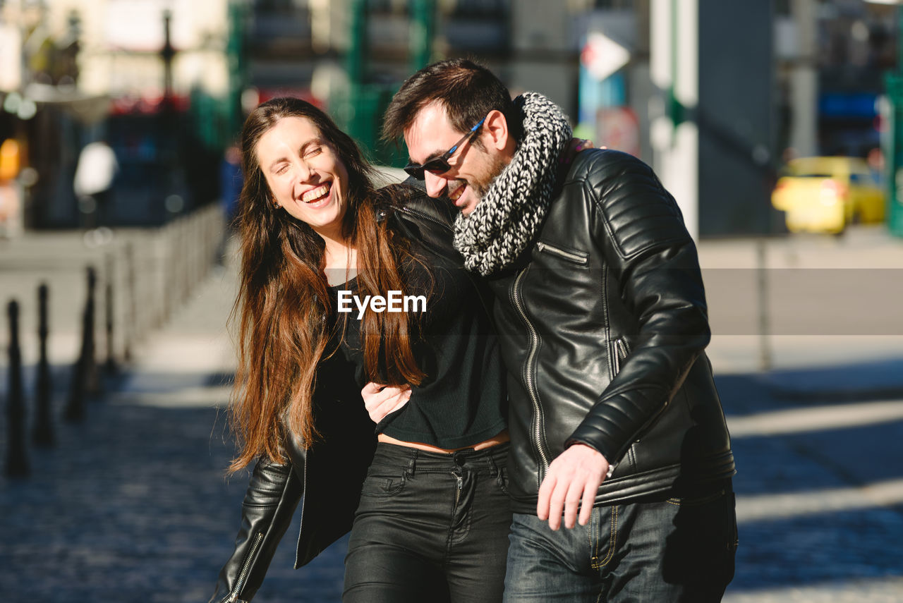 Couple standing in city