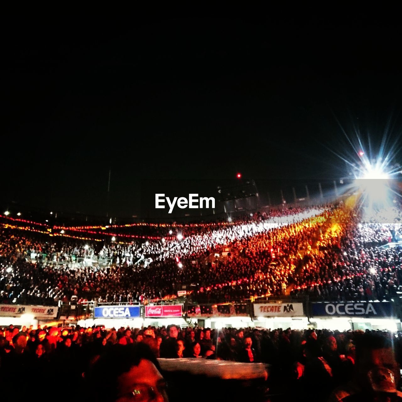 CROWD AT ILLUMINATED NIGHT DURING FESTIVAL