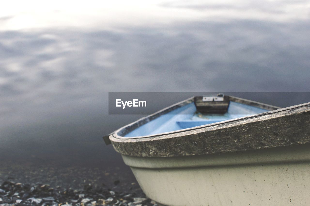 Close-up of boat moored on shore