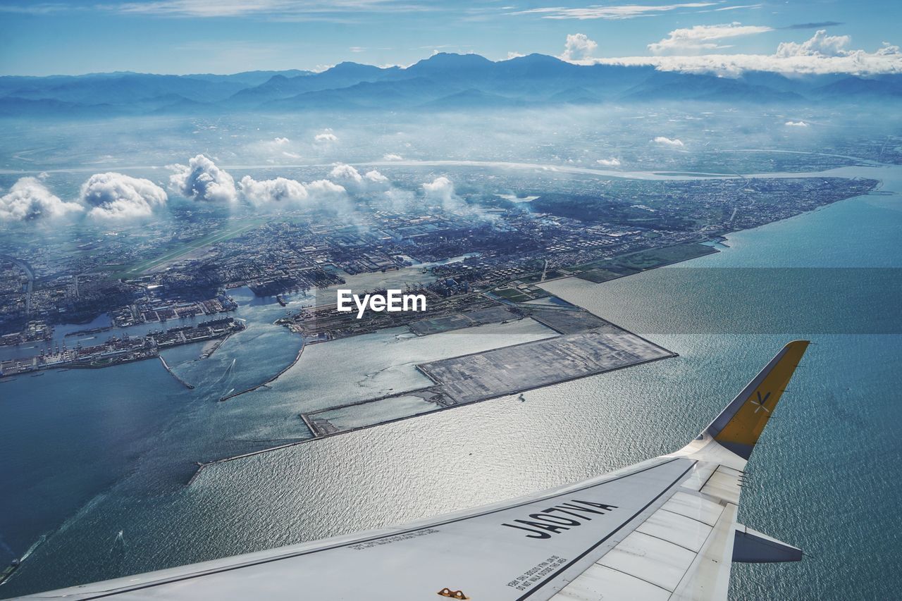 AERIAL VIEW OF SEA AND CITYSCAPE