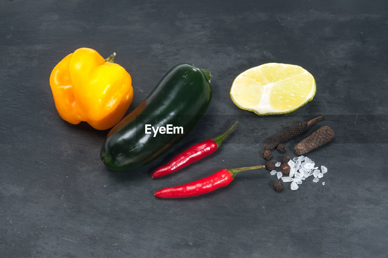 HIGH ANGLE VIEW OF VEGETABLES ON TABLE AGAINST BACKGROUND