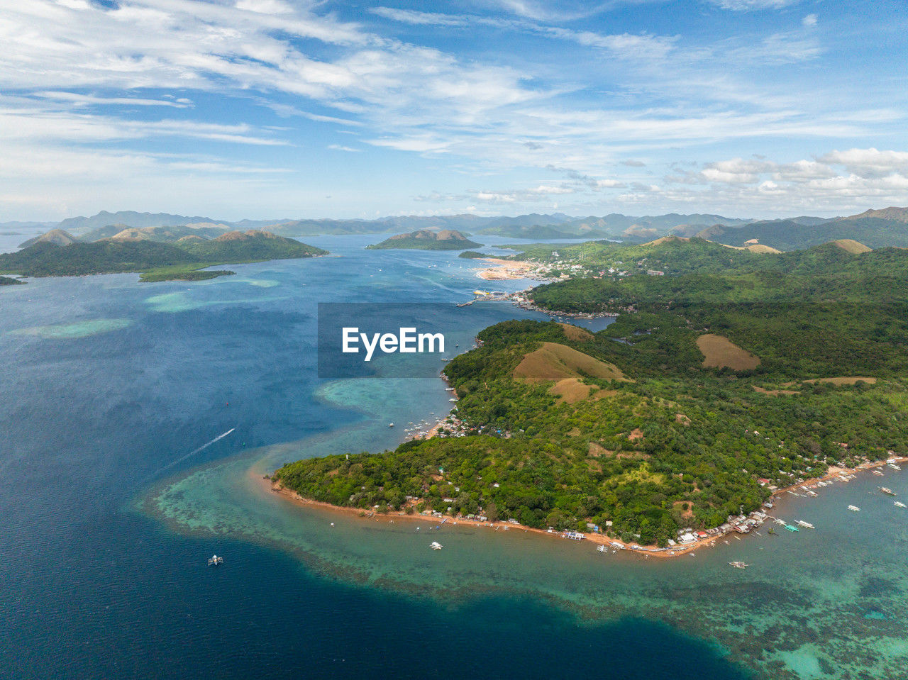 high angle view of sea and mountains against sky