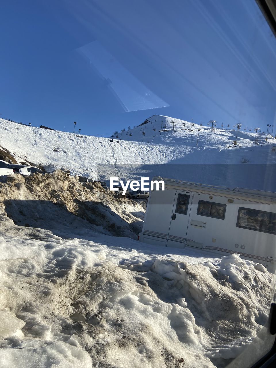 SNOW COVERED LANDSCAPE AGAINST SKY