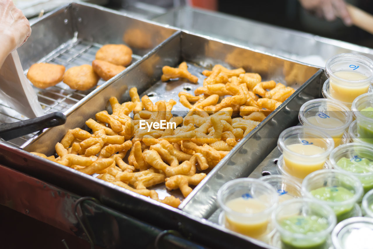 HIGH ANGLE VIEW OF FOOD FOR SALE IN KITCHEN