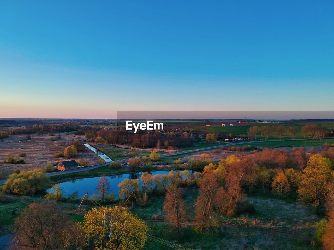 Scenic view of landscape against clear blue sky