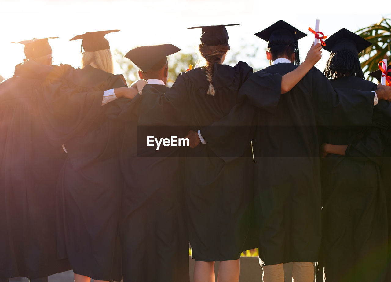 Rear view of woman wearing graduation gown