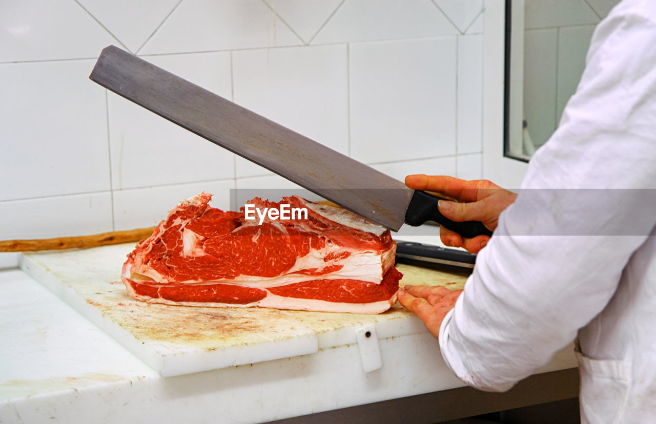 Midsection of man preparing food