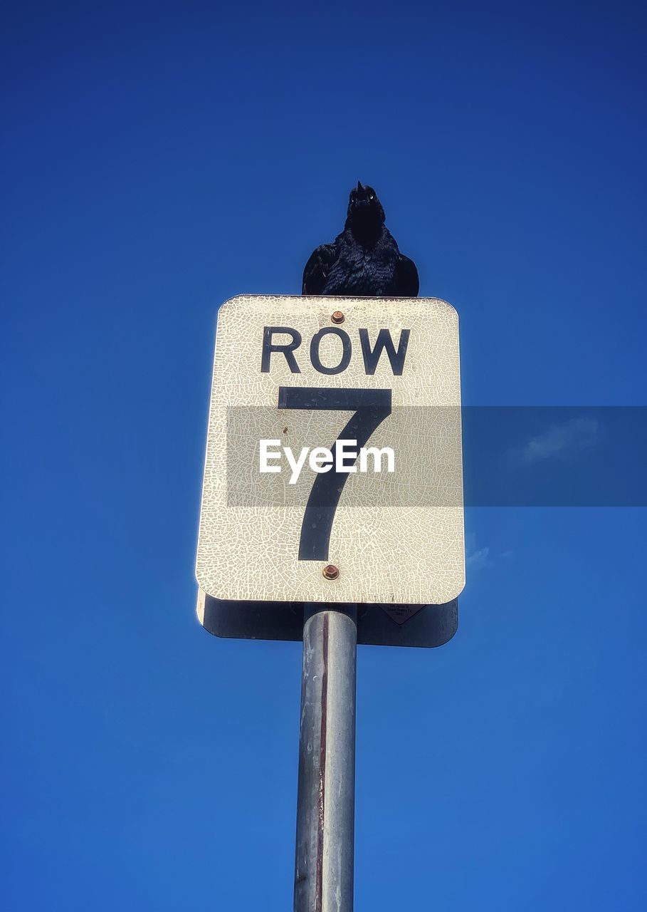 LOW ANGLE VIEW OF ROAD SIGN AGAINST SKY