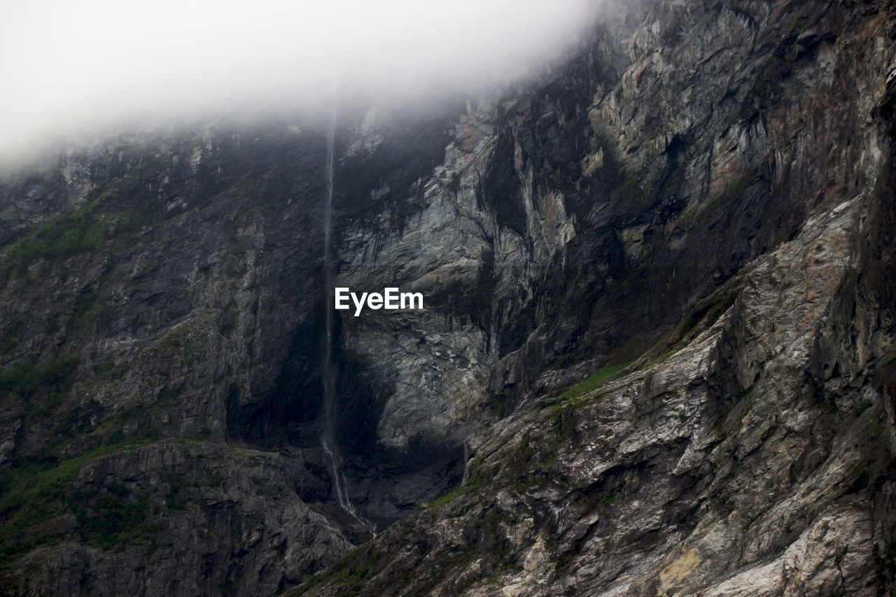 Scenic view of  mountains with fog