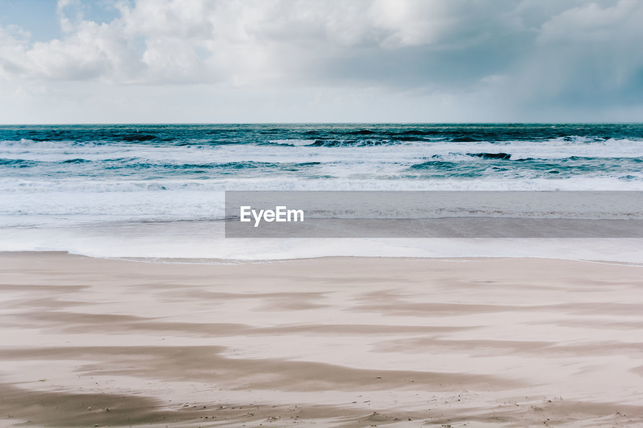 Scenic view of beach against sky