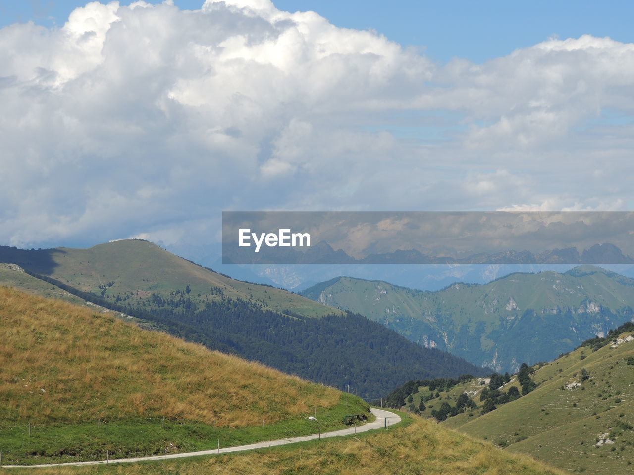 SCENIC VIEW OF LAND AND MOUNTAINS AGAINST SKY