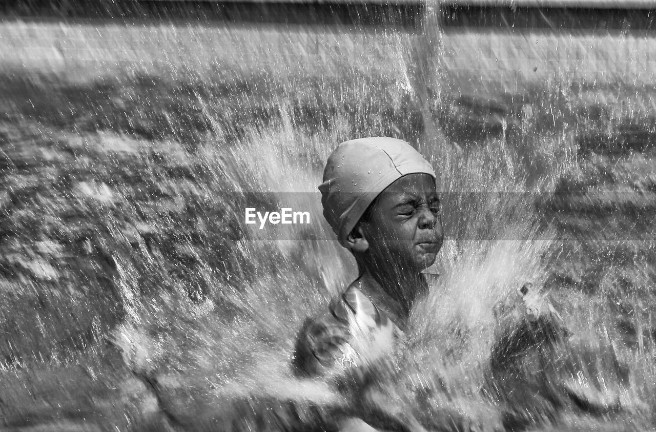 YOUNG WOMAN IN WATER