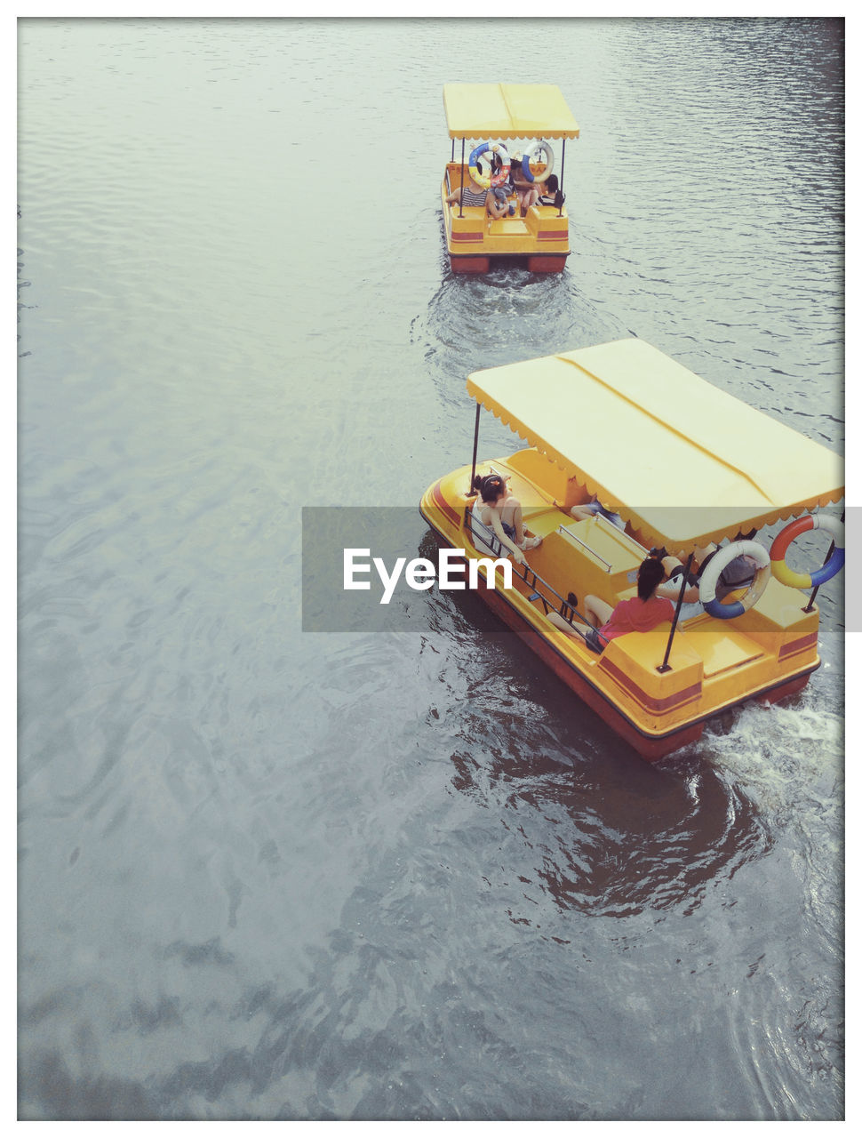 High angle view of people in nautical vessel on lake