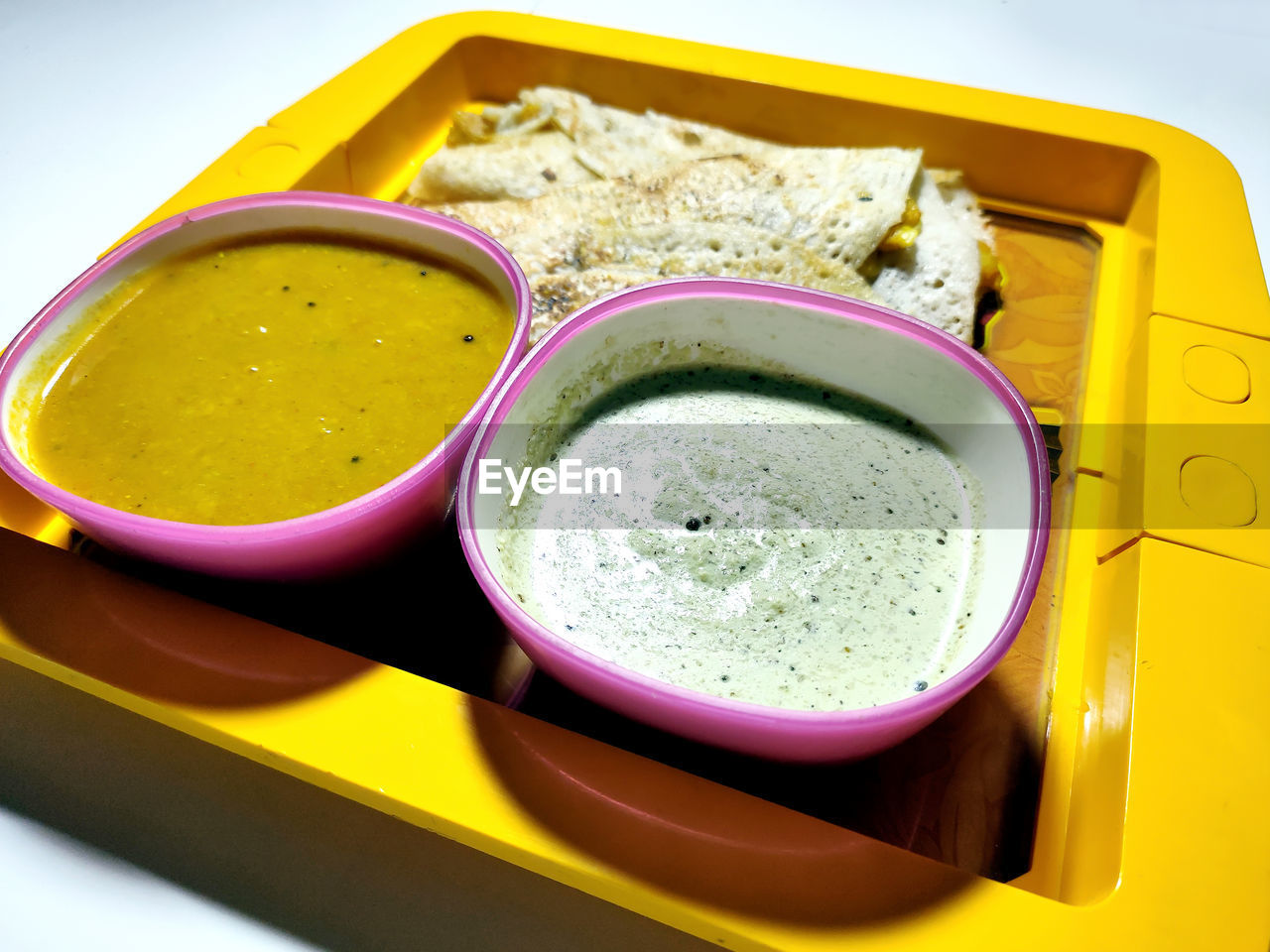 Masala dosa with sambhar and chutney, very famous south indian dish. top view selective focus