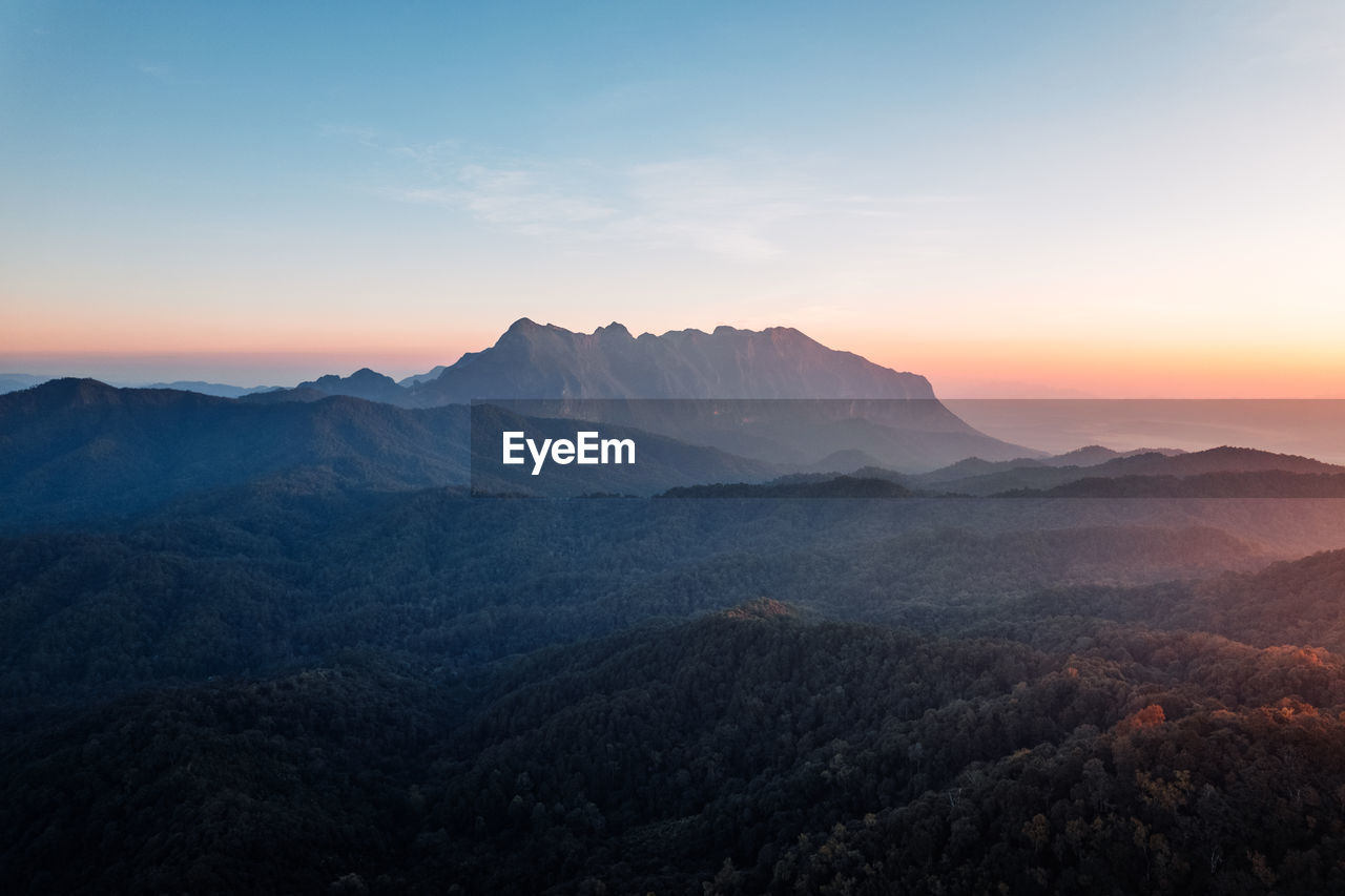 Tranquil scene of mountains against sky during sunset