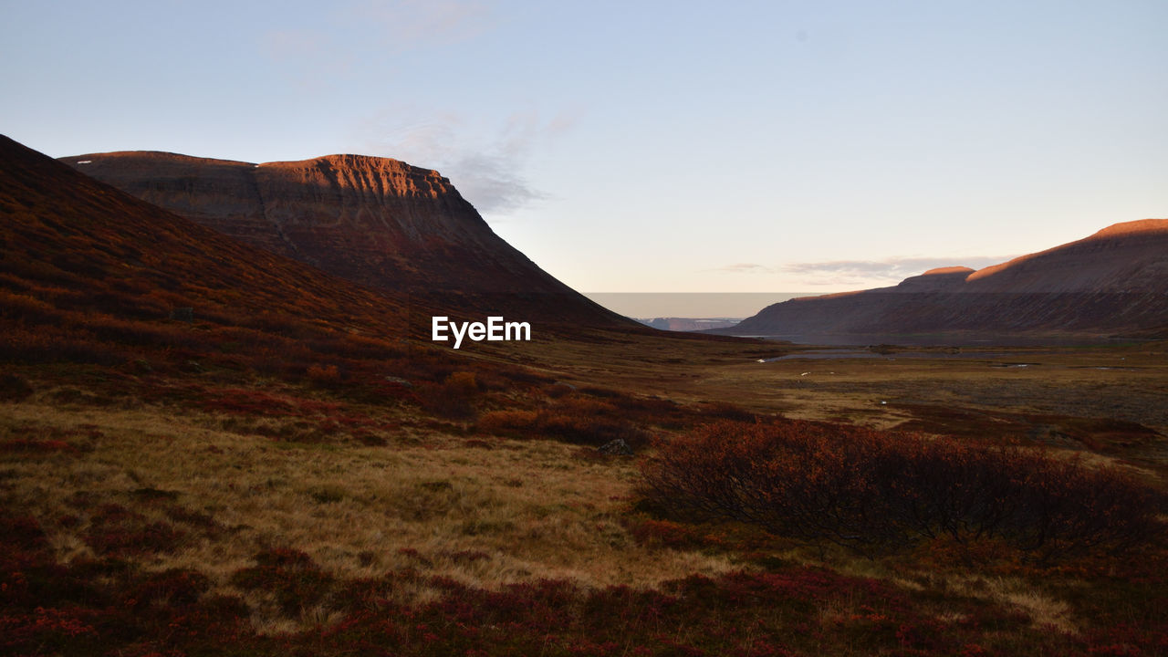 Scenic view of landscape against sky during sunset