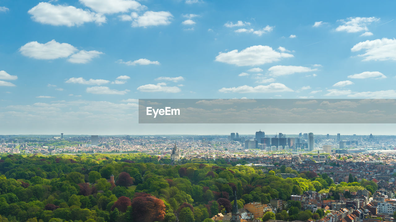 Panoramic view of sea and cityscape against sky