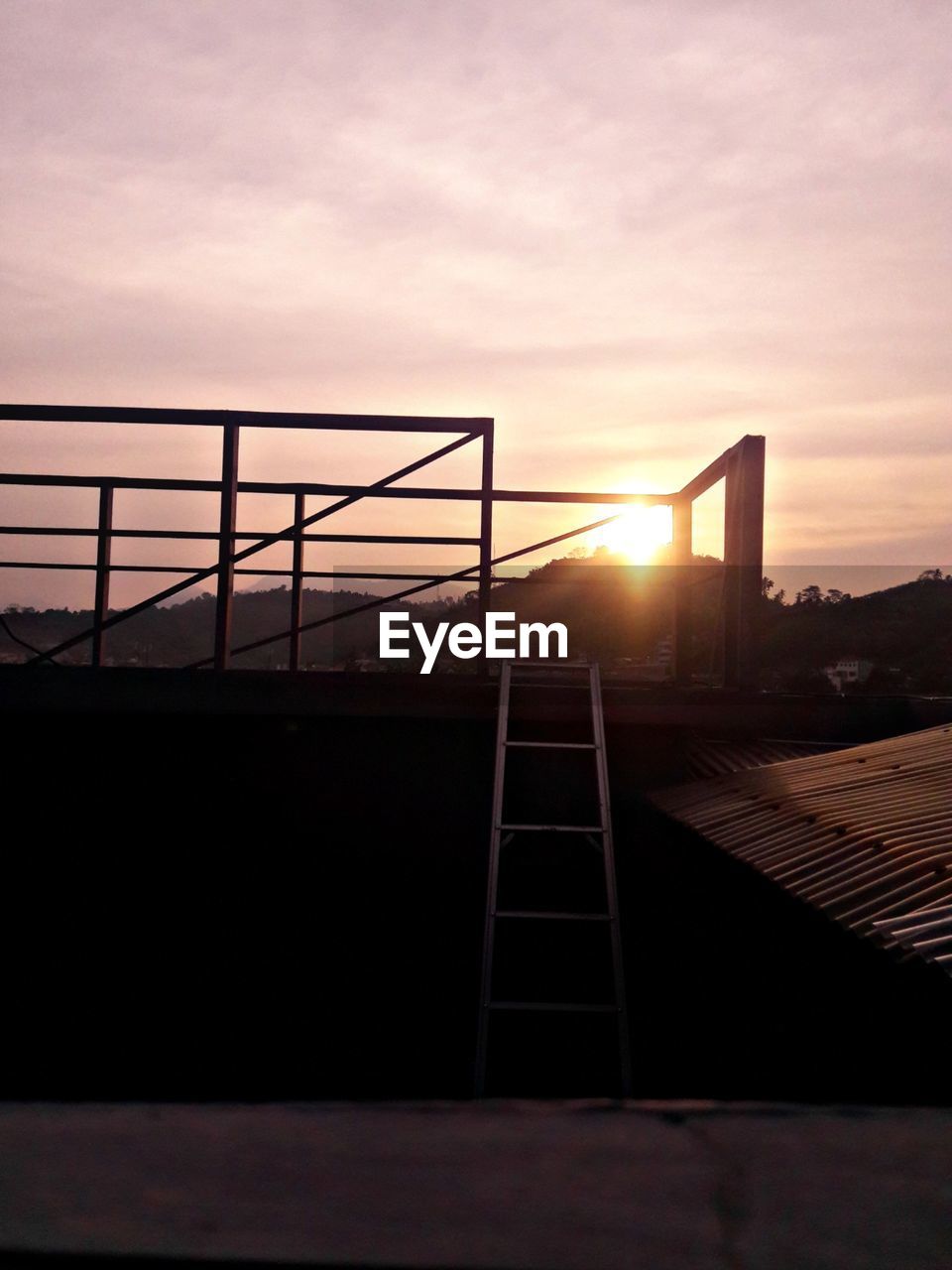 SILHOUETTE OF BUILDING AT SUNSET