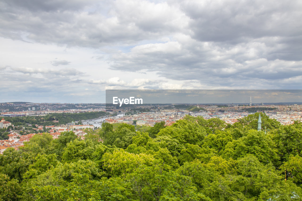 high angle view of cityscape against cloudy sky
