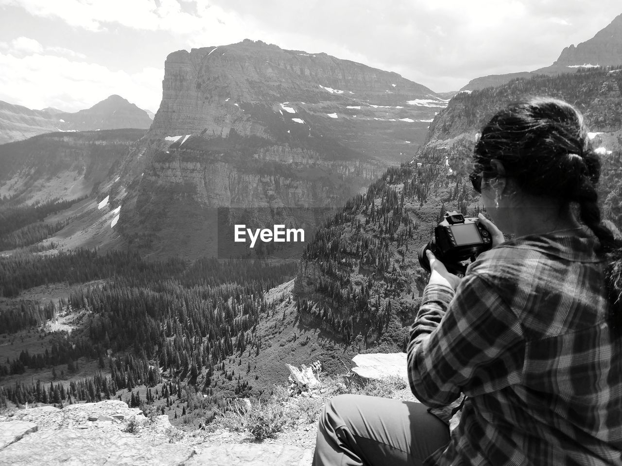 REAR VIEW OF WOMAN PHOTOGRAPHING ON MOUNTAINS