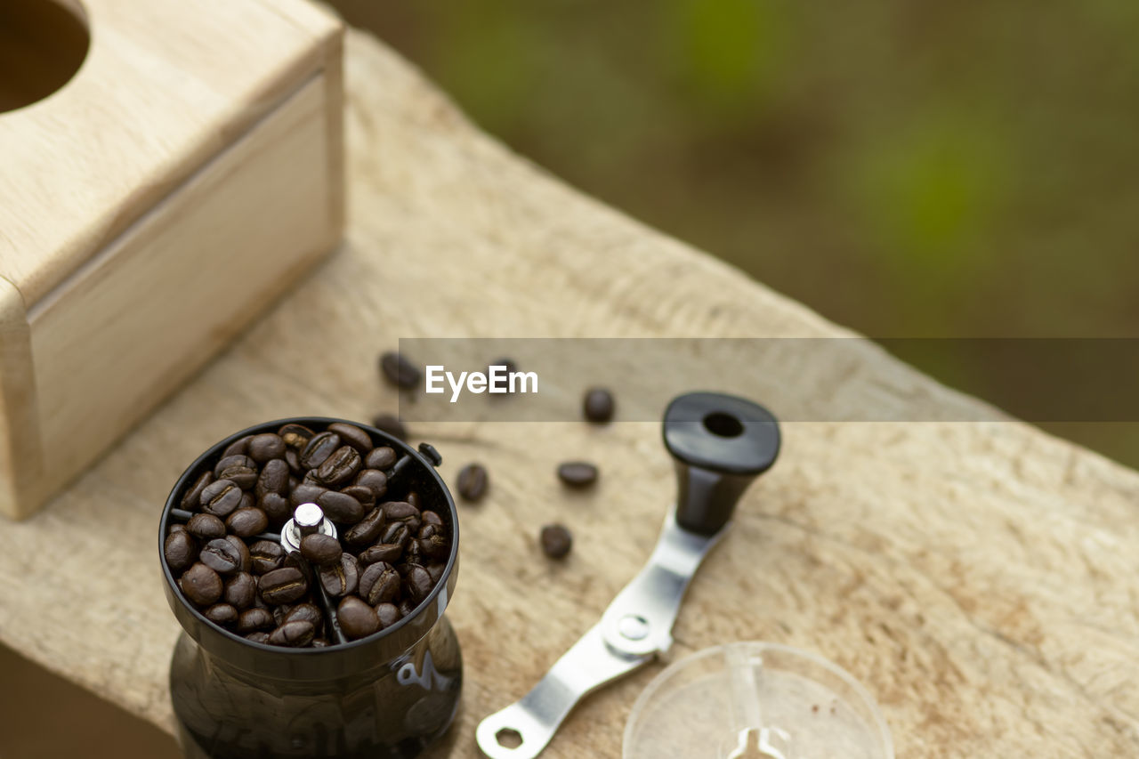 wood, no people, focus on foreground, close-up, food and drink, high angle view, container, indoors