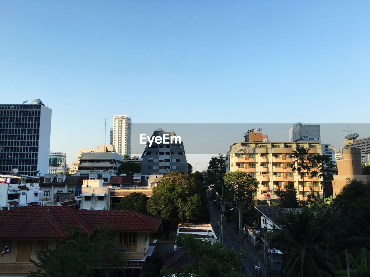 VIEW OF BUILDINGS AGAINST BLUE SKY