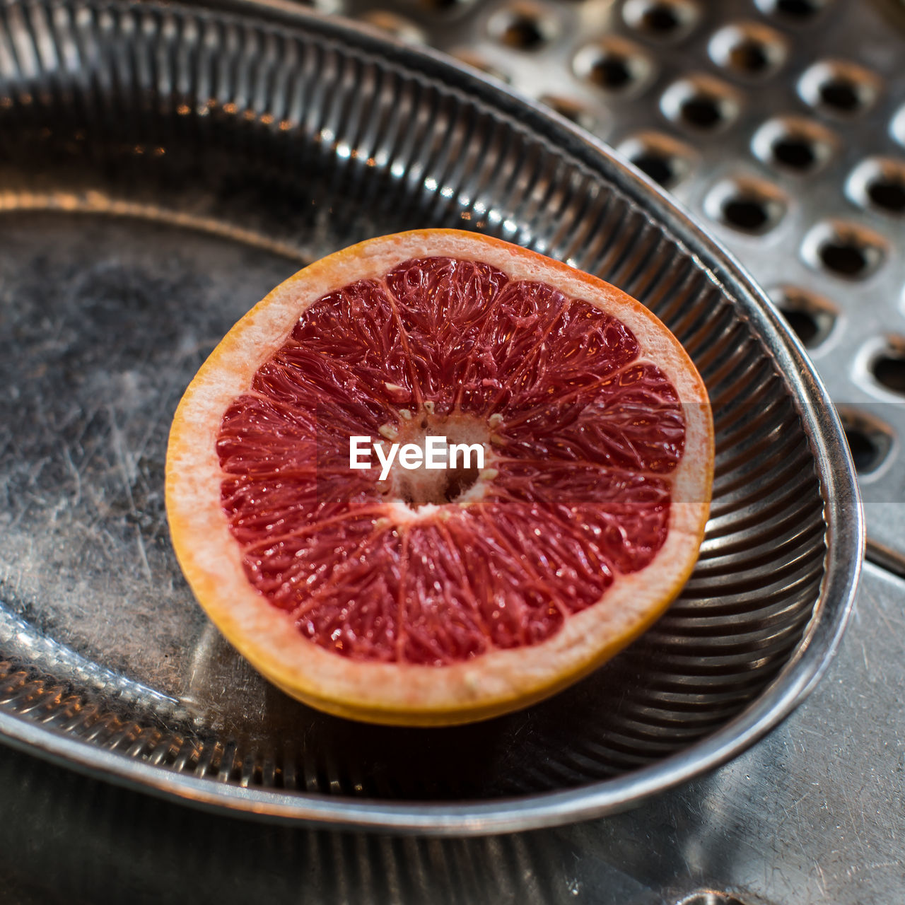 High angle view of grapefruit in plate on table