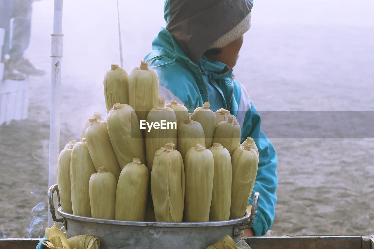 Man standing by corns