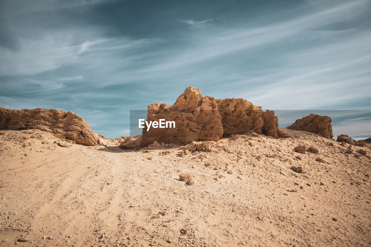 Rock formations in desert against sky