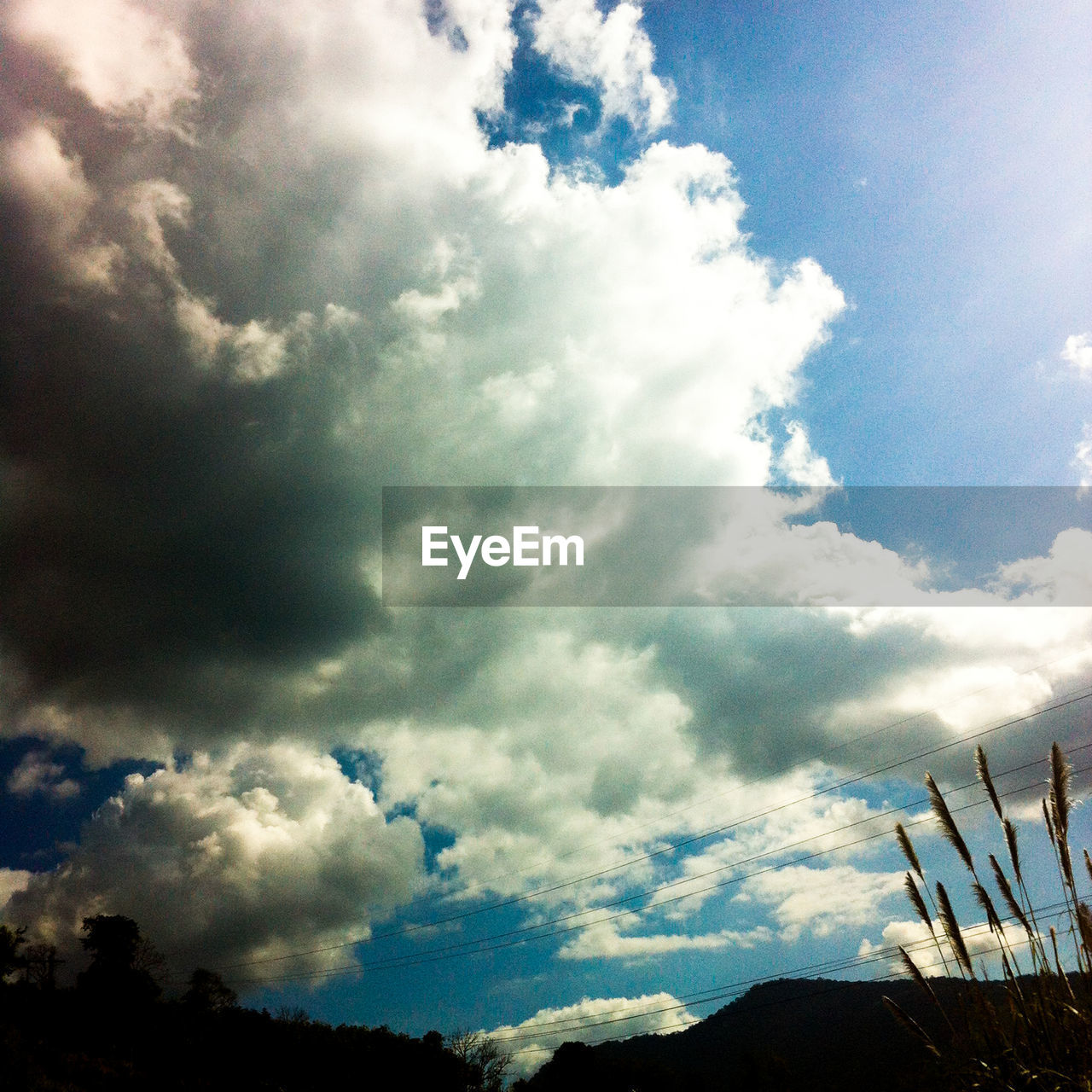 LOW ANGLE VIEW OF SKY AGAINST CLOUDS