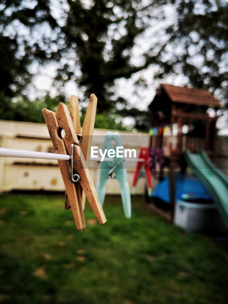 Close-up of clothespins on clothesline