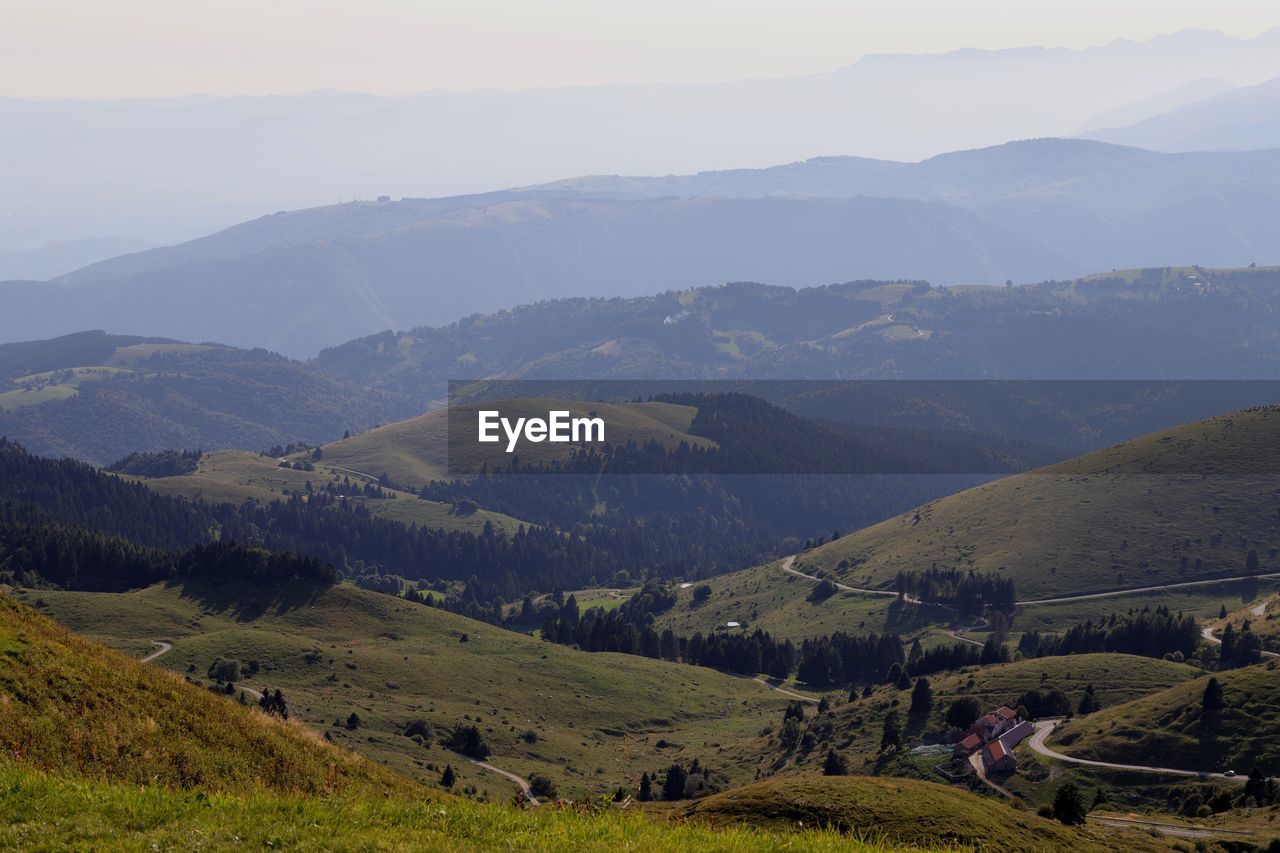 Scenic view of landscape and mountains against sky