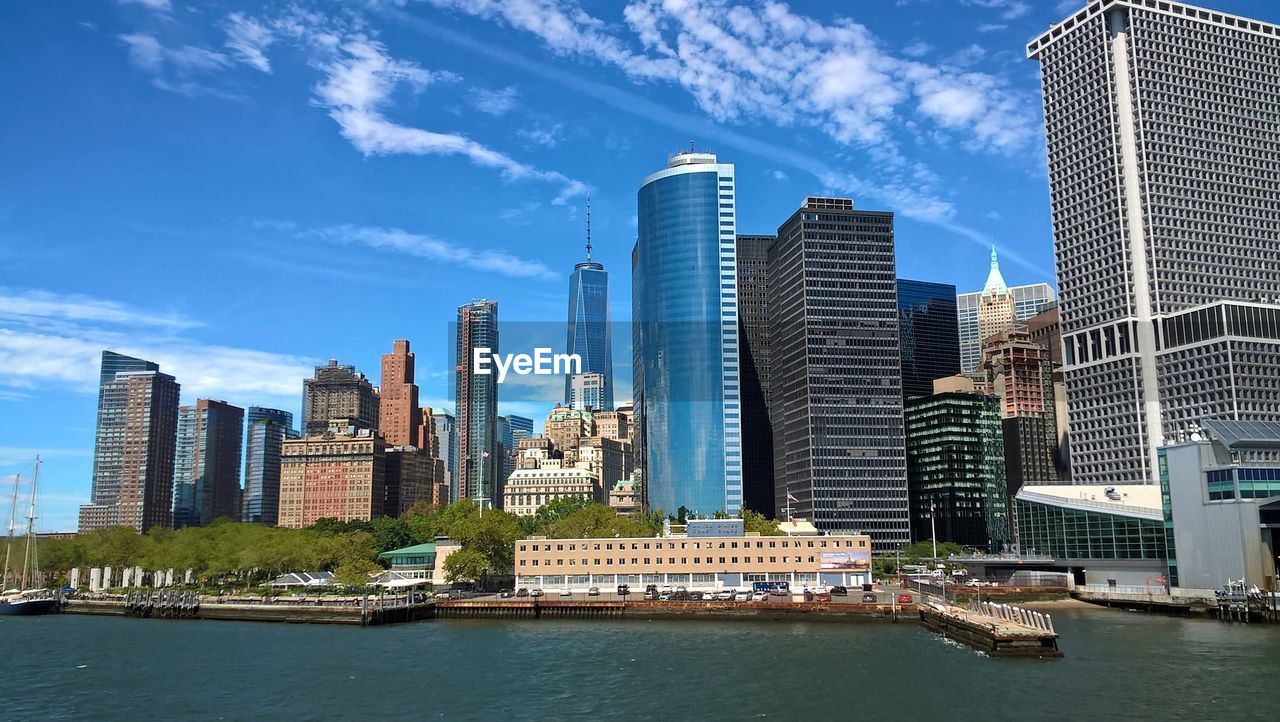 View of skyscrapers against cloudy sky