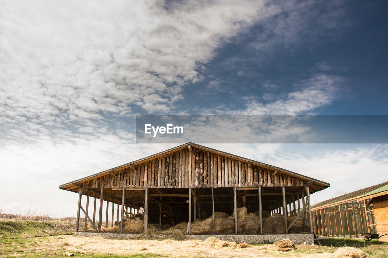 Low angle view of barn against sky