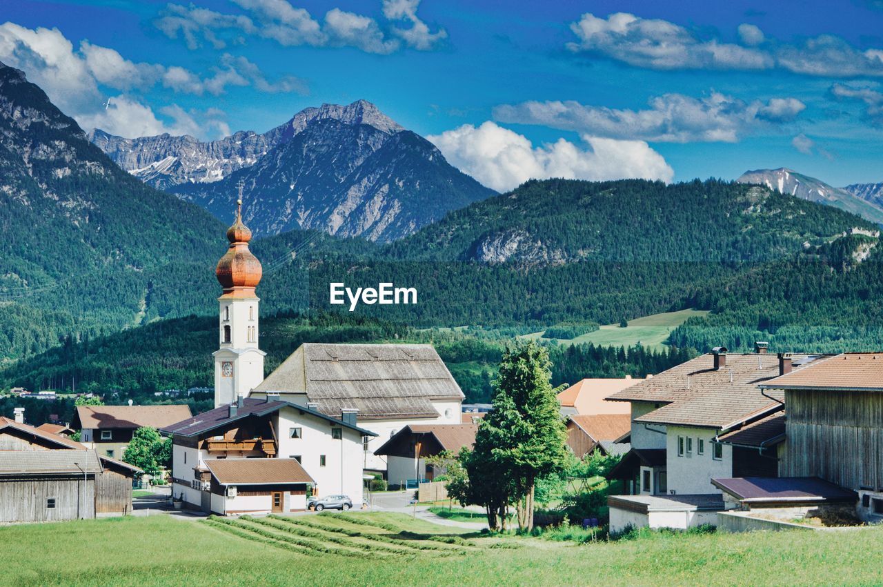 Houses and buildings against sky