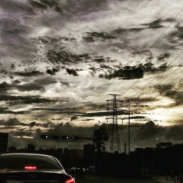 VIEW OF ROAD AGAINST CLOUDY SKY