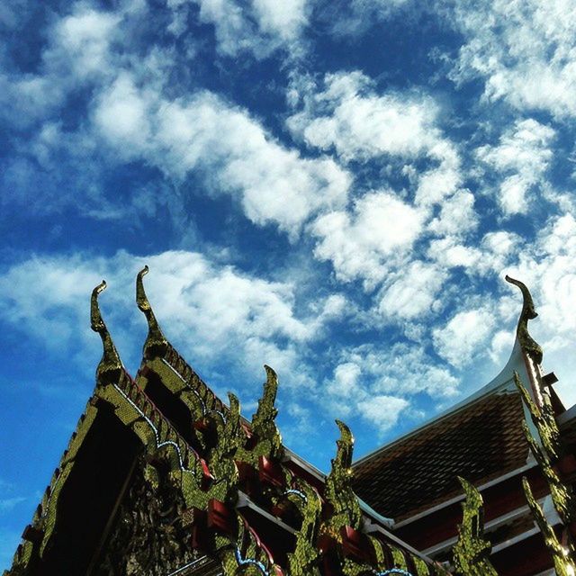 LOW ANGLE VIEW OF TEMPLE AGAINST CLOUDY SKY