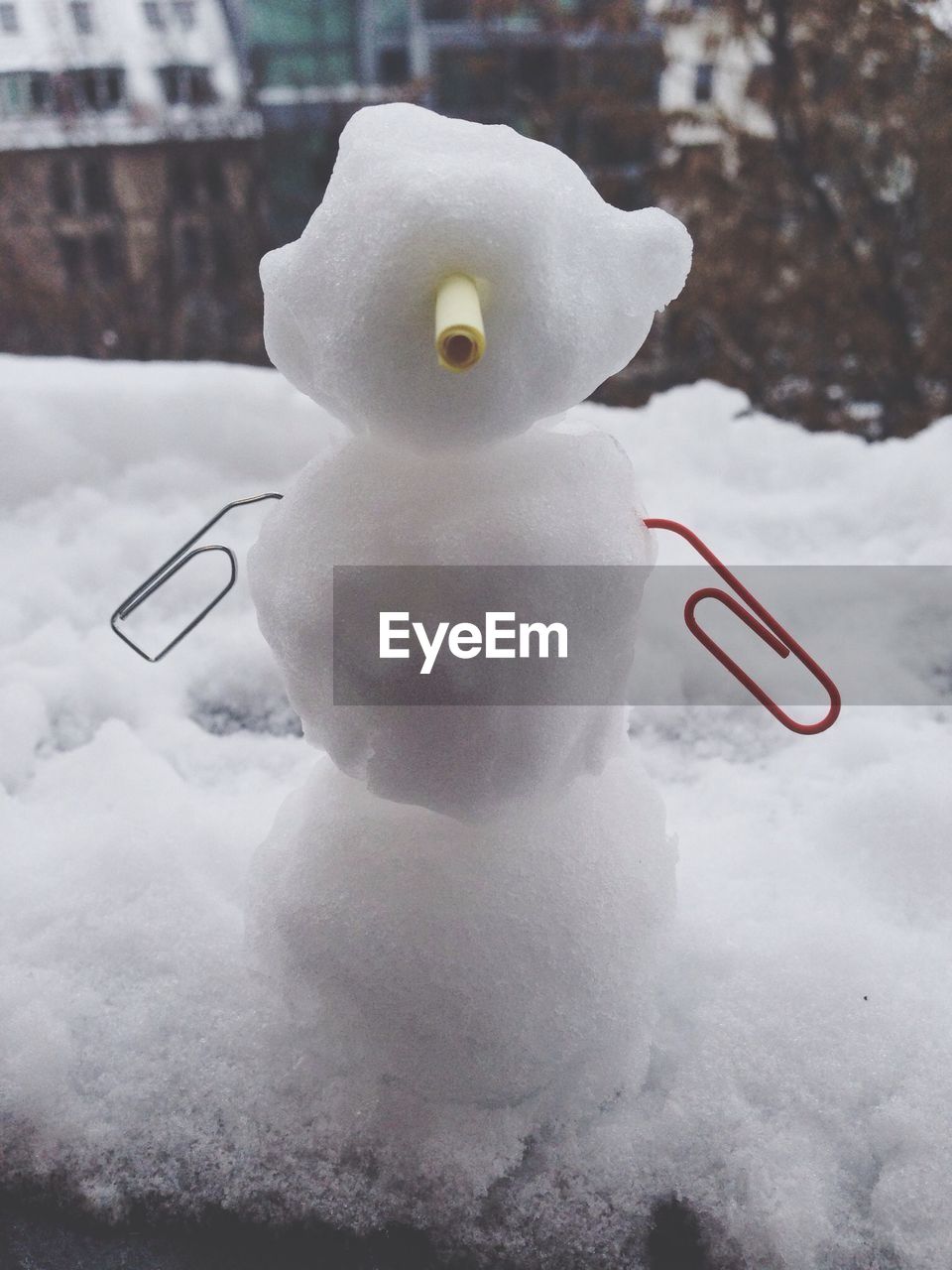 Snowman on snow covered landscape