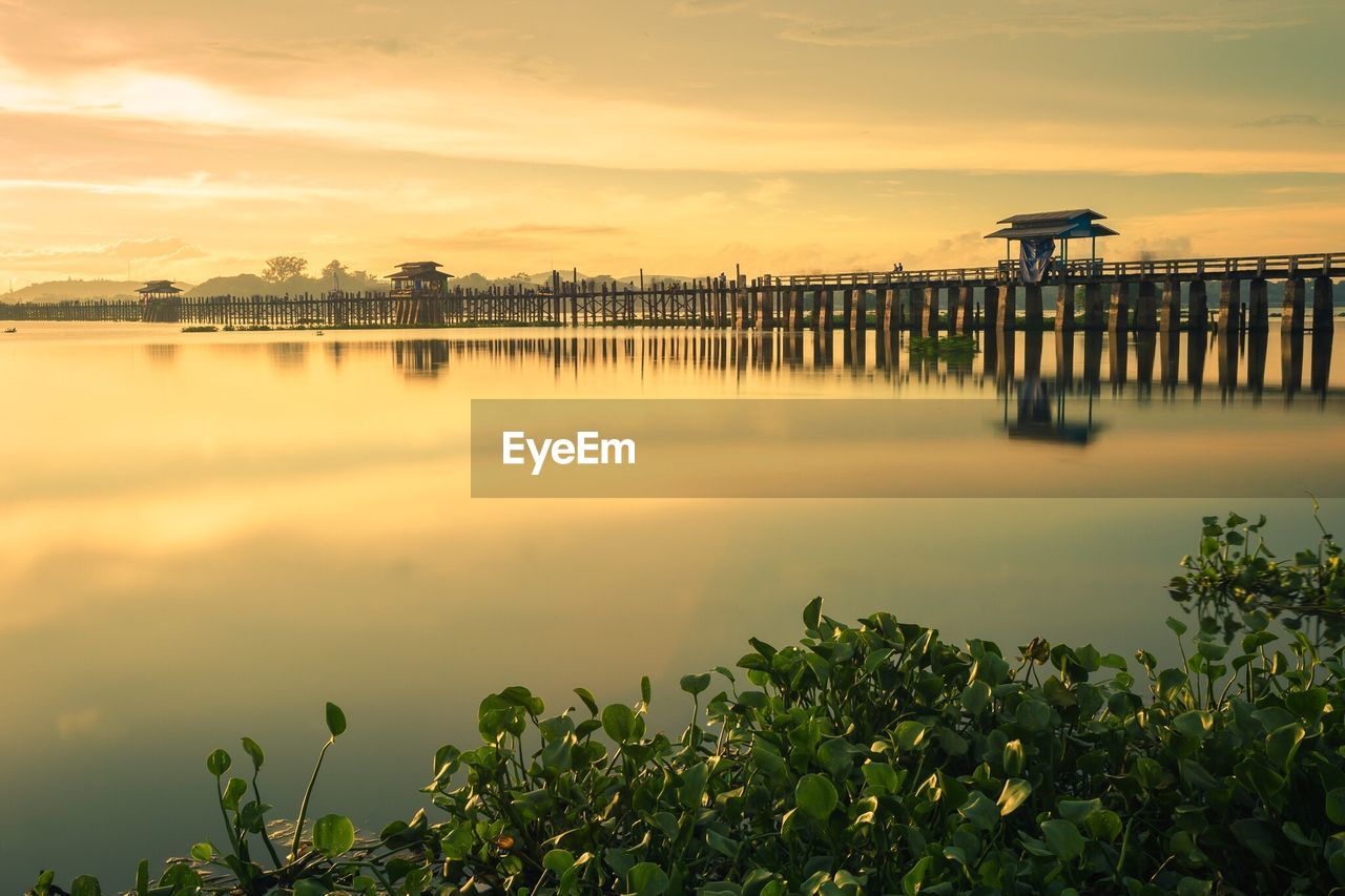 Scenic view of lake against sky during sunset