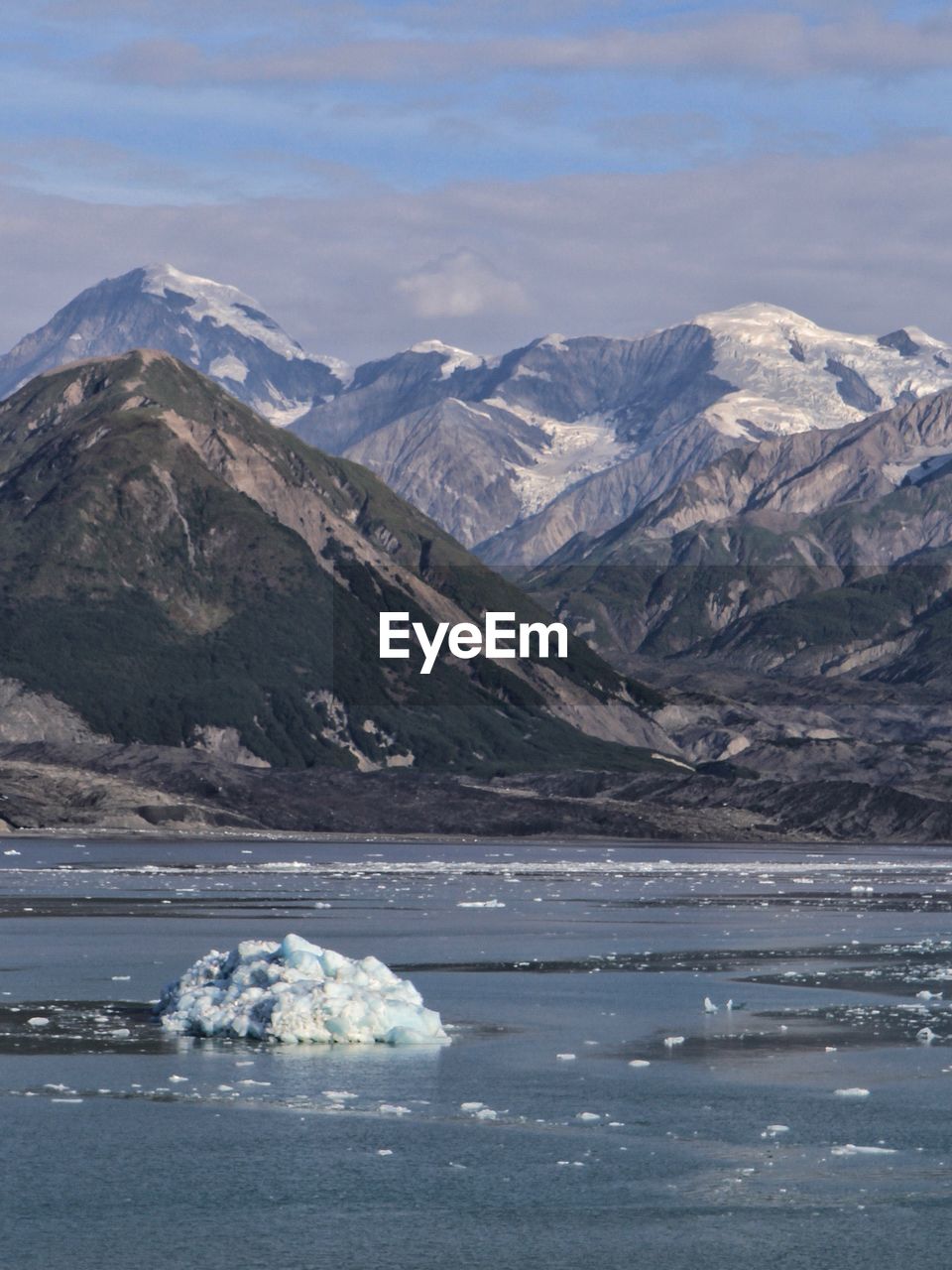 Scenic view of mountains and sea against sky