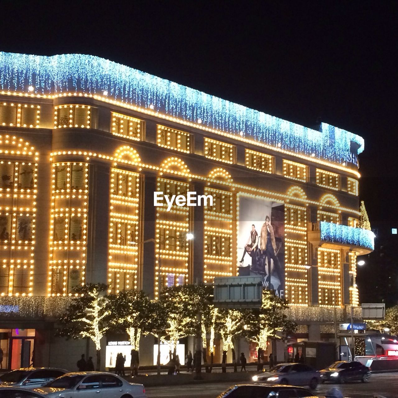 VIEW OF CITY STREET AT NIGHT