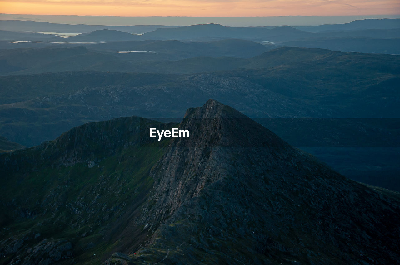 High angle view of mountains against sky during sunset