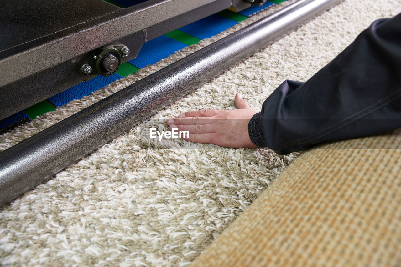 Low section of man working on railroad track