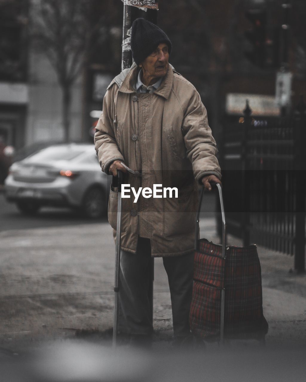 Senior man looking at city street