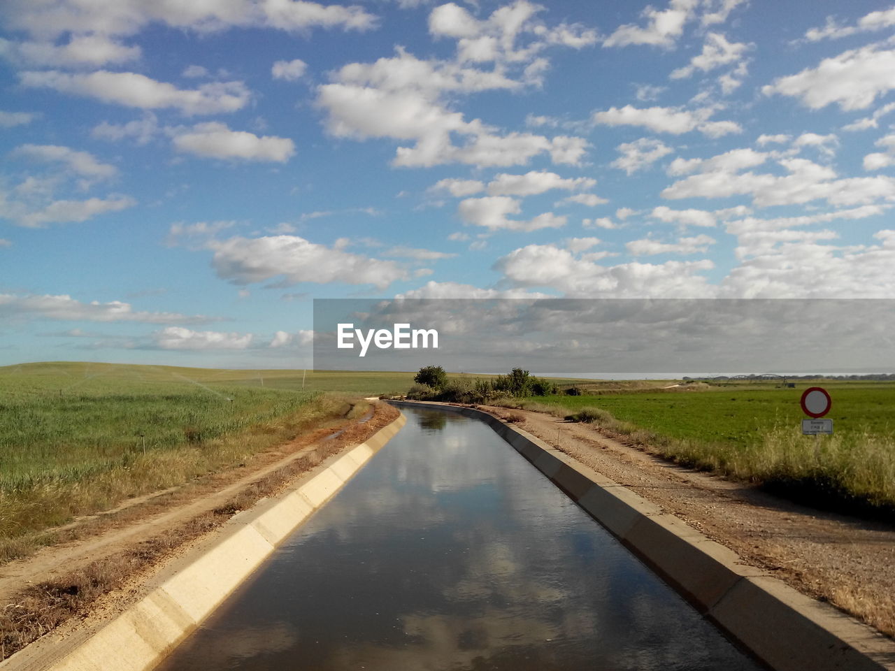 Narrow canal along landscape