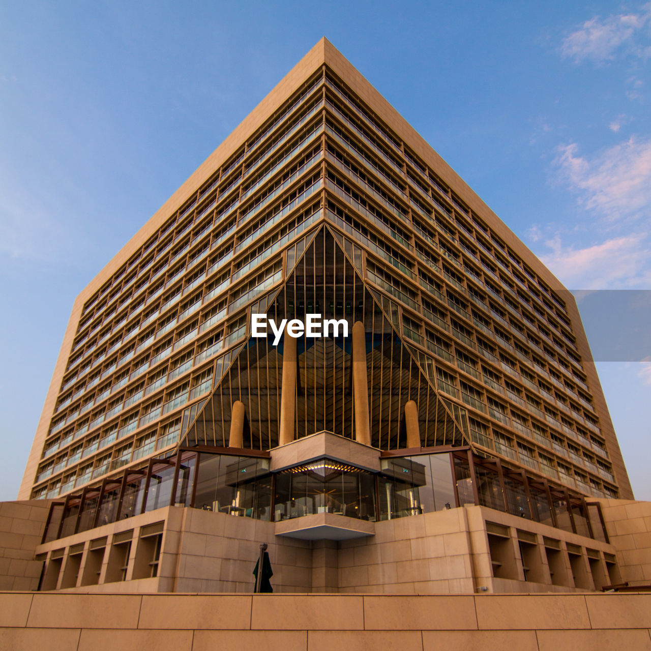 LOW ANGLE VIEW OF OFFICE BUILDING AGAINST SKY