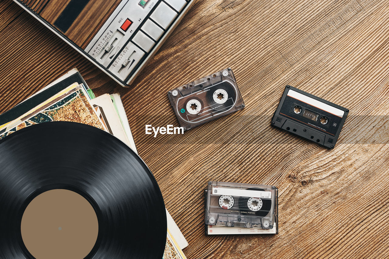 Vinyl records, cassette tapes and cassette recorder. retro music style. 80s music party. vintage